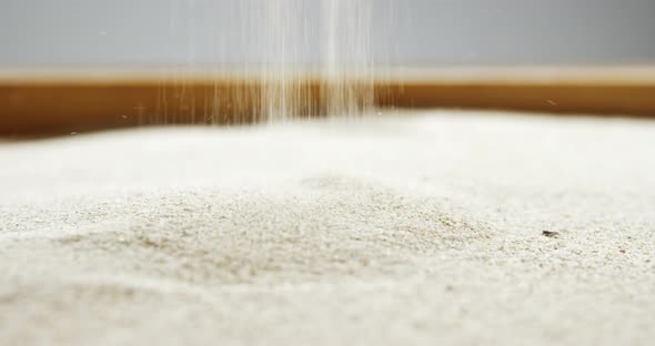 Close-up of pouring sand