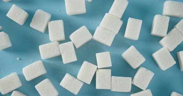 On the Table Slowly Rotate Sugar in Cubes