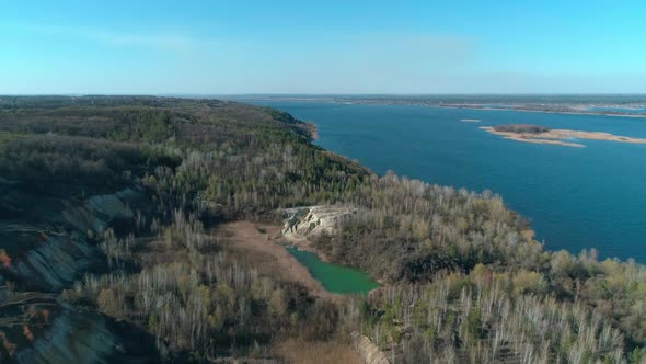 Abandoned Clay Quarry with Unusual Relief Near River Dnipro. Aerial Top View