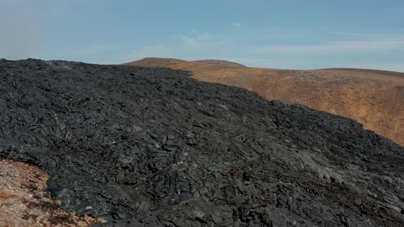 Fly Over Dark Stripe of Cooling Volcanic Material