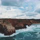 Movig drone shot of waves crashing against cliffs - VideoHive Item for Sale