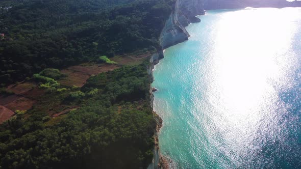 Flight over high cliffs of sea coast, aerial view. Aerial drone video of iconic white rock steep cli