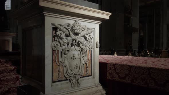 Column of Saint Peter's Baldachin lit with sun light.