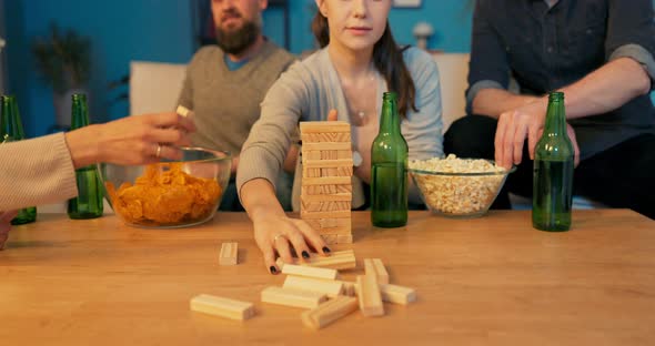 Four Friends Spend Weekend Evening Watching Movies Playing Games Drinking Beer Women Take Turns