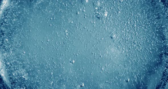 Oxygen Bubbles in Water on a Blue Abstract Background