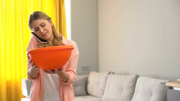 Upset Household Calling Roof Repair Service While Water Leaking From Ceiling