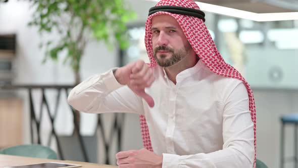 Disappointed Arab Businessman Doing Thumbs Down 