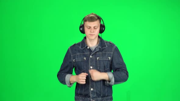 Handsome Guy in Big Headphones Is Running, Chroma Key