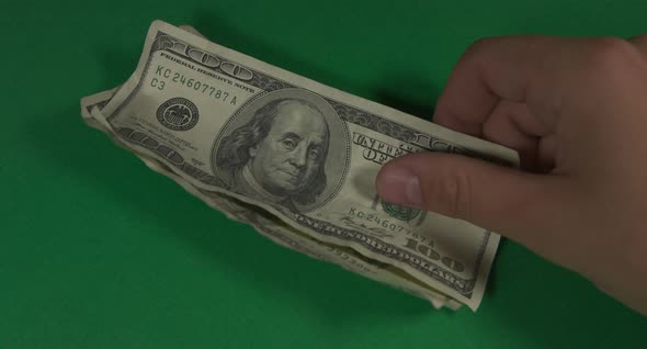 Dollars. American Money Close-up on a Green Background Hromakey . 100 Dollar Bills. One Hundred