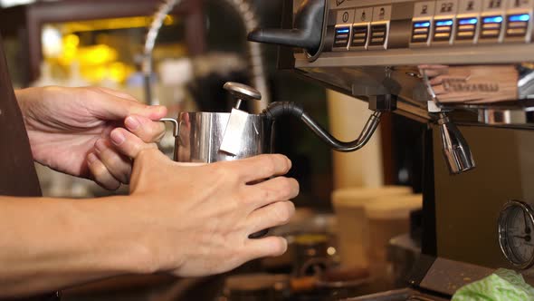 Barista Worker People Using Coffee Machine To Streaming Milk For Special Beverage