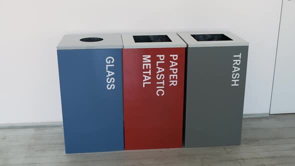 Colorful, Plastic Garbage Bins, with Recycle Logo Stacked in the Office. Sorting, Metal, Plastic