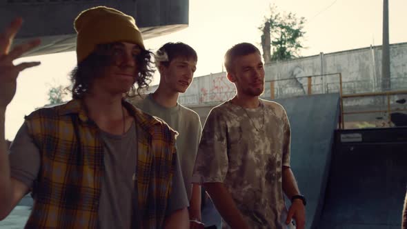 Calm Hipsters Walking Together in Skatepark