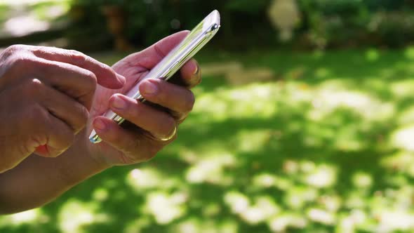 Senior man using mobile phone