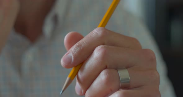 Male Hand Spinning Pencil Around his Fingers