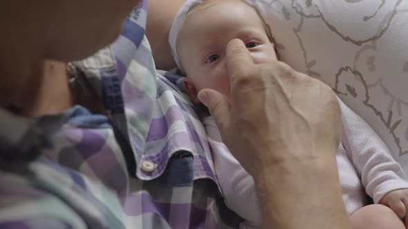 Careful and Loving Grandpa with Baby Granddaughter