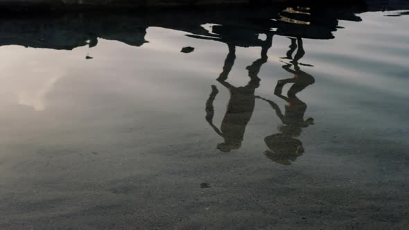 Couple on rippled water at beach 4k