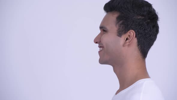 Closeup Profile View of Happy Young Indian Man Thinking