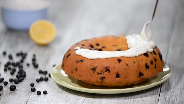 Homemade bundt cake with icing and black berries