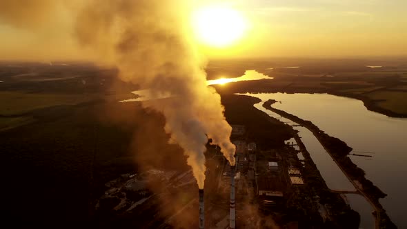 Old smokestack of factory. Pollution and smoke from chimneys of factory