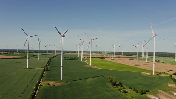 A Drone Shot of a Massive Wind Farm in Agricultural Land