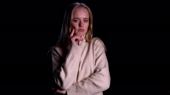 Young Confused Girl Standing Isolated Over Black Background Looking Camera