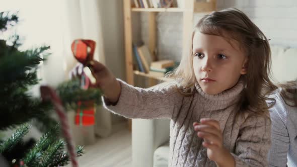 Child Together With Pregnant Woman Mother Dress Up Christmas Tree