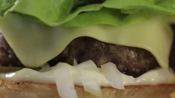 Beef Cheese Burger Display Close Up - Tilt - Bottom To Top