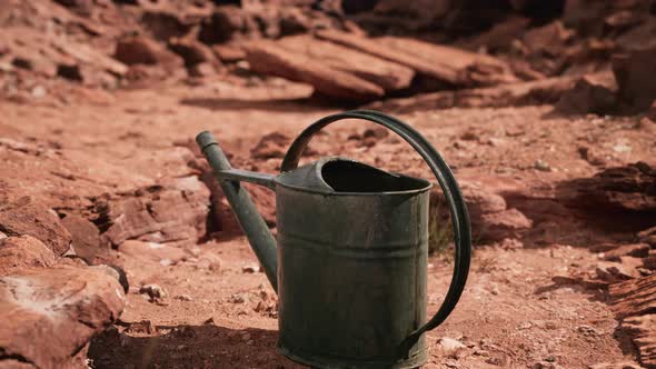 Beverage Can in Sand and Rocks Desert