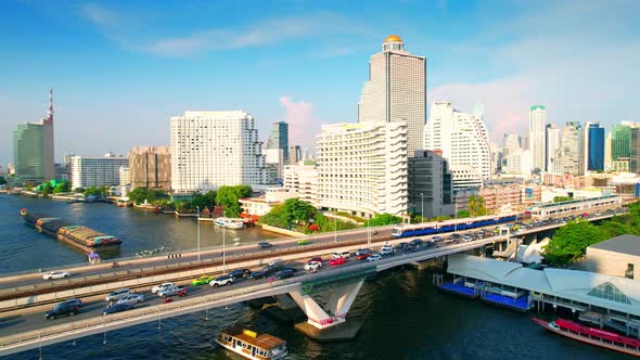 4K : Drones fly over the Chao Phraya River, buildings and business districts in Bangkok