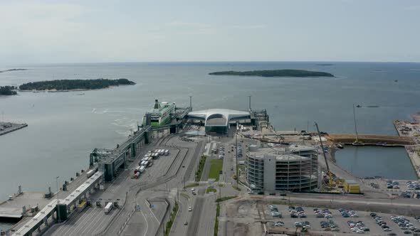 Static aerial view high above port in Helsinki, Finland with large ship at dock.