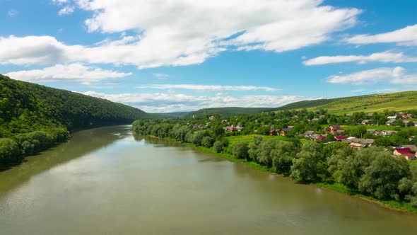 Landscape with River, Hills and Village