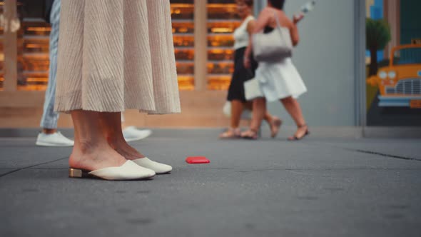 Young tourist dropping a mobile phone