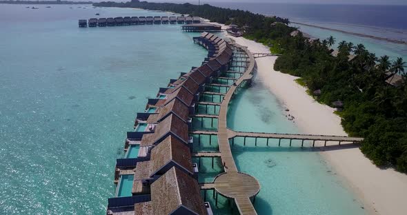 Natural aerial clean view of a white sandy paradise beach and turquoise sea background in colourful 