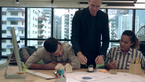 Creative Business People Group Having Conversation at Office Desk in Workplace