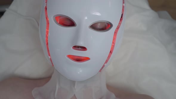 Closeup Male Face in LED Light Therapy Device Top View