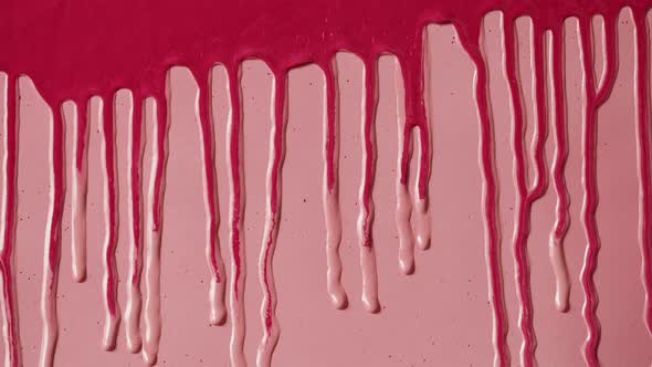 Red Paint Background Color Tint Drops on Pink Wall Closeup