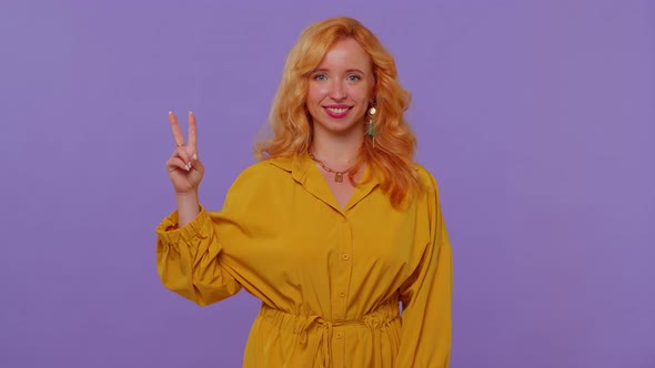 Pretty Stylish Smiling Girl Showing Victory Sign Hoping for Success and Win Doing Peace Gesture