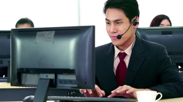 Business People Wearing Headset Working in Office