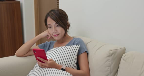 Woman check on smart phone at home