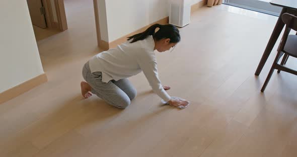 Asian Housewife woman wash the floor with rag