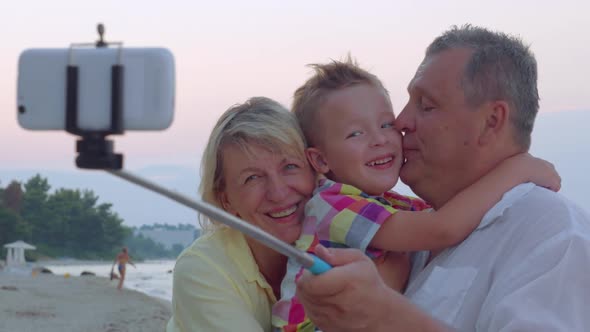 Family Mobile Selfie with Child and Grandparents