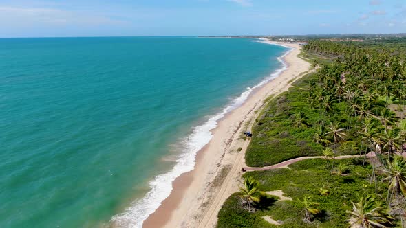 Aerial View of Tropical White Sand Beach and Turquoise Clear Sea Water with Small Waves