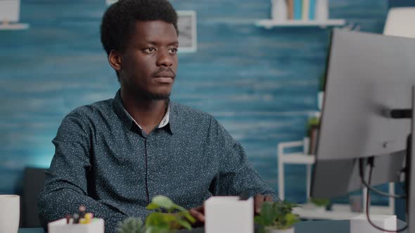 Closeup Portrait of Black African American Man Working on Computer