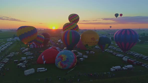 Aerial View of a Morning Launch of Hot Air Balloons at a Hot Air Balloon Festival at Sunrise