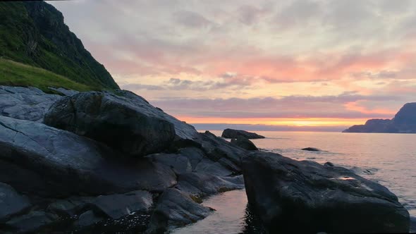 Drone Flying Over the Rocks with the View of the Sunset