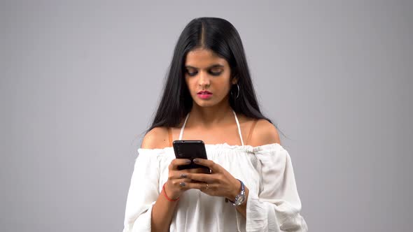 Indian girl using smartphone