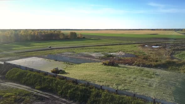 Aerial Silage Ramming Bulldozers Tamp Silo in Pit By Road