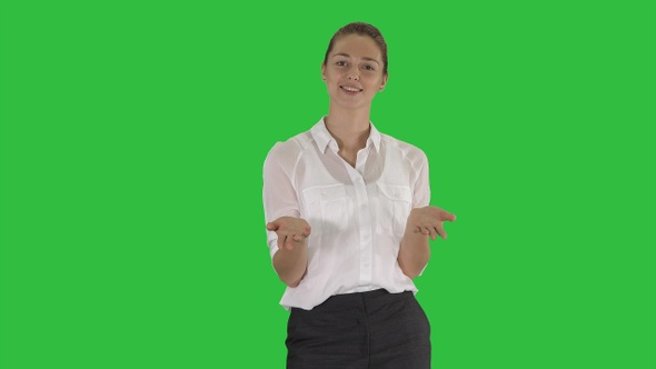 Woman looking into the camera and talking on a Green Screen