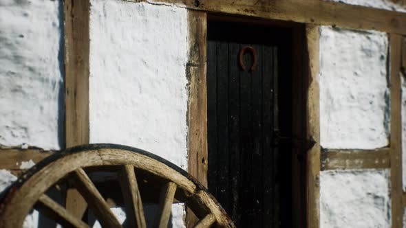 Old Wood Wheel and Black Door at White House alt