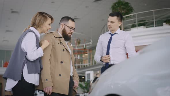 Sales Manager in a Car Dealership Serves a Married Couple